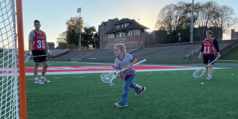 Intercollegiate lacrosse event benefits youngster battling brain tumor