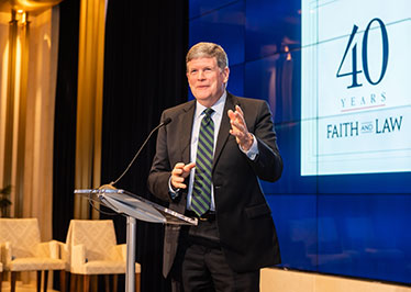 Faith and Law presents co-founder McNulty with Colson award
