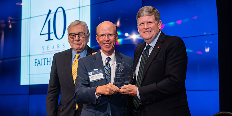 Faith and Law presents co-founder McNulty with Colson award